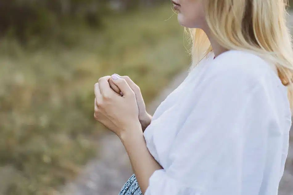 Pregnant woman praying about her baby and future