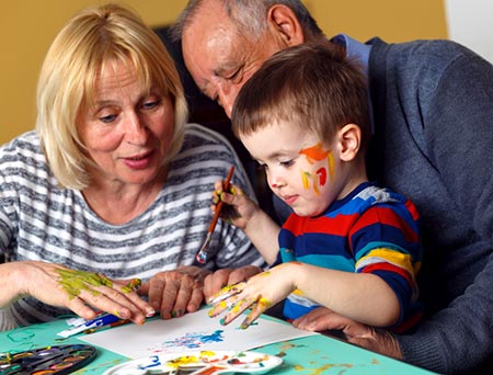 Catholic birth grandparents stay in touch and finger-paint with adopted grandson