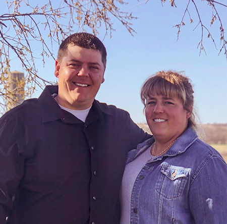 Hopeful Catholic adoptive couple in Kansas pose for an outdoor photo