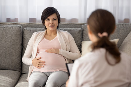 woman getting adoption counseling from a professional counselor