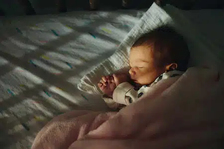 baby sleeping peacefully - fill out your free Catholic adoption application today