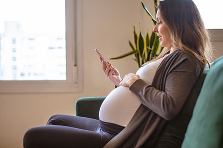 pregnant woman talking to her peer adoption counselor