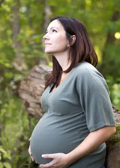 Pregnant woman praying about her baby and future